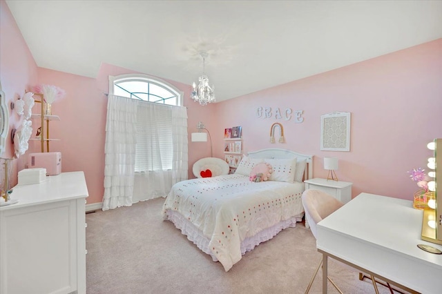 bedroom with light carpet and a notable chandelier