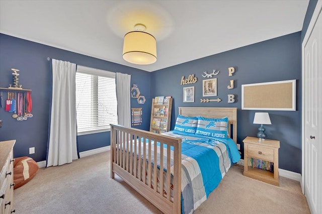 bedroom with carpet floors and baseboards