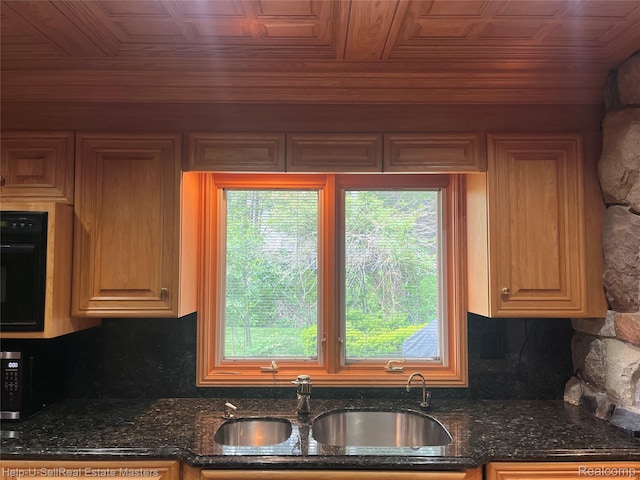3015 E Village Ln, Port Huron, MI 48060 - kitchen featuring a sink, decorative backsplash, an ornate ceiling, and dark stone counters