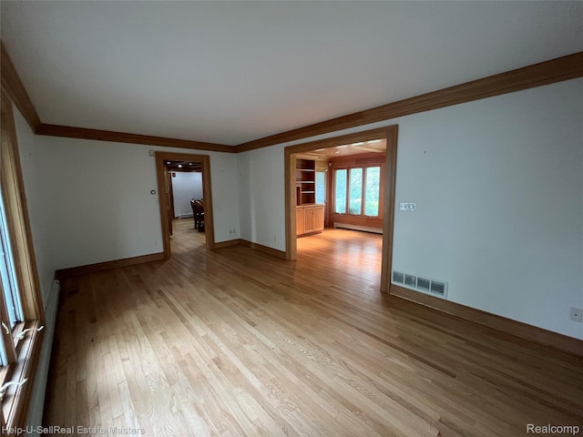 3015 E Village Ln, Port Huron, MI 48060 - empty room featuring ornamental molding, light wood-type flooring, a baseboard heating unit, and baseboards