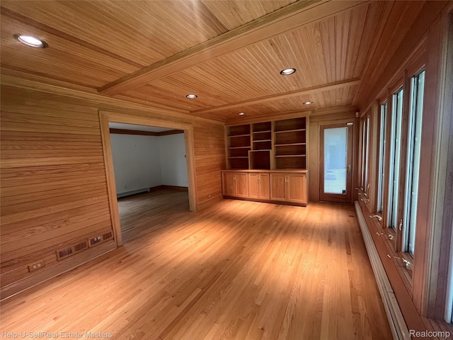 3015 E Village Ln, Port Huron, MI 48060 - unfurnished room with wooden ceiling with exposed beams, wood walls, a baseboard heating unit, built in shelves, and light wood-type flooring