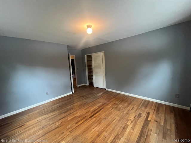 3015 E Village Ln, Port Huron, MI 48060 - spare room with wood finished floors and baseboards