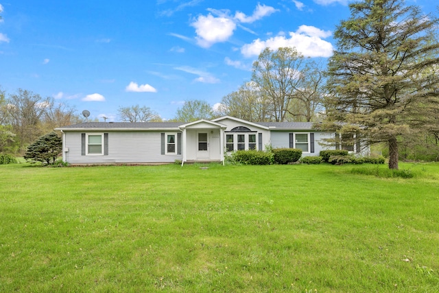 single story home featuring a front yard