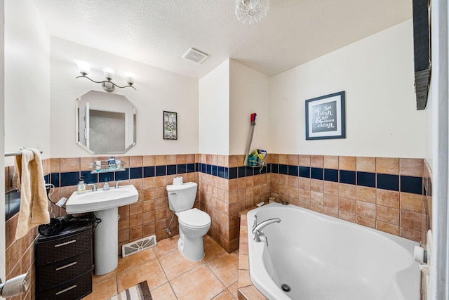 full bath with toilet, tile patterned flooring, visible vents, and a bath