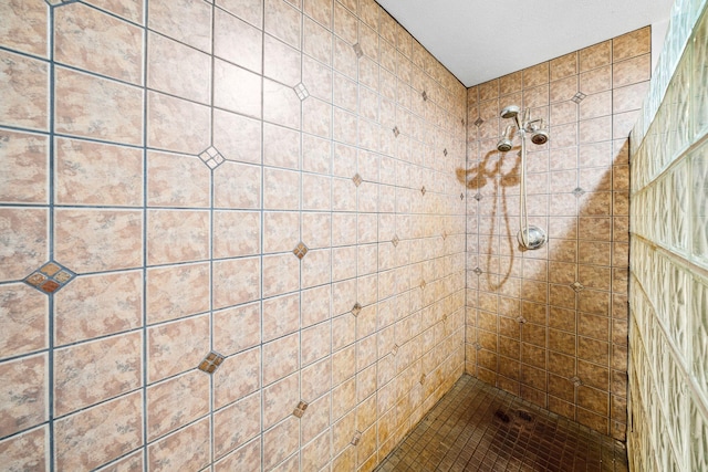 bathroom with tiled shower
