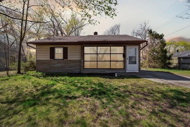 view of outbuilding with fence