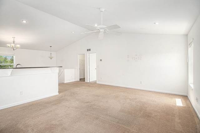 823 Glenlivet St, Howell, MI 48843 - unfurnished living room with light colored carpet, recessed lighting, a chandelier, ceiling fan, and high vaulted ceiling