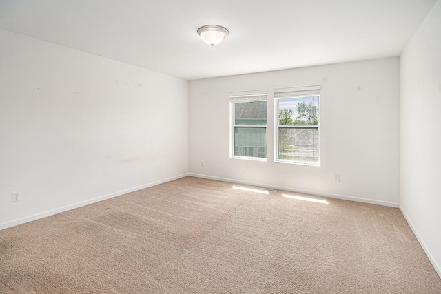 823 Glenlivet St, Howell, MI 48843 - carpeted spare room featuring baseboards
