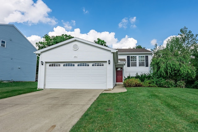 823 Glenlivet St, Howell, MI 48843 - view of front of house with a front lawn, concrete driveway, and a garage