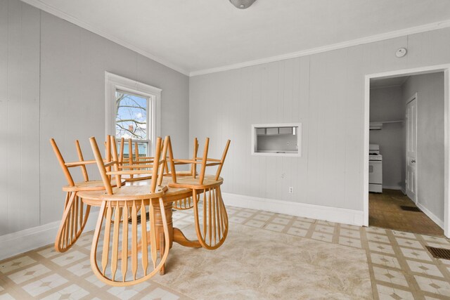 dining room with baseboards, ornamental molding, tile patterned floors, and visible vents