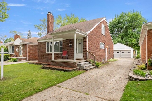 bungalow featuring a chimney, an outdoor structure, a front yard, a garage, and brick siding