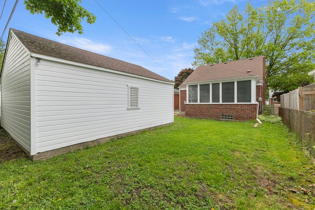 back of property featuring an outbuilding