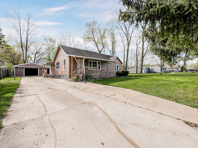 single story home with a garage, an outbuilding, a front lawn, and covered porch