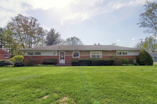 ranch-style home featuring a front yard and brick siding