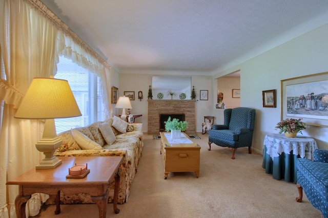 living area with a stone fireplace and light colored carpet
