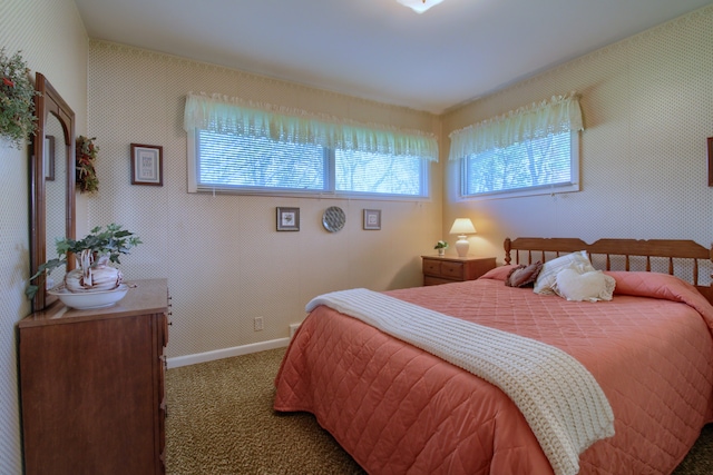 bedroom featuring carpet flooring and baseboards