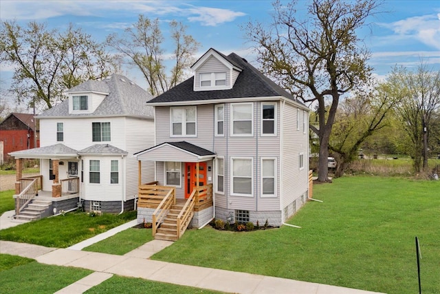 traditional style home with a front lawn, roof with shingles, and covered porch