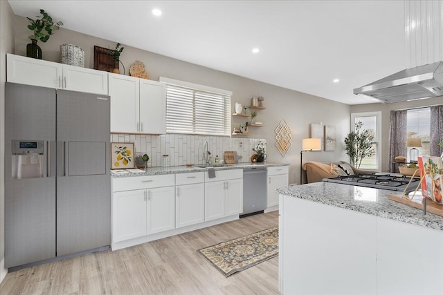 kitchen with fridge with ice dispenser, white cabinets, decorative backsplash, and dishwasher