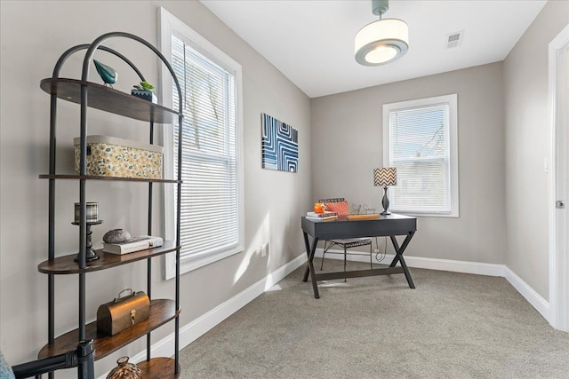 carpeted home office with baseboards and visible vents