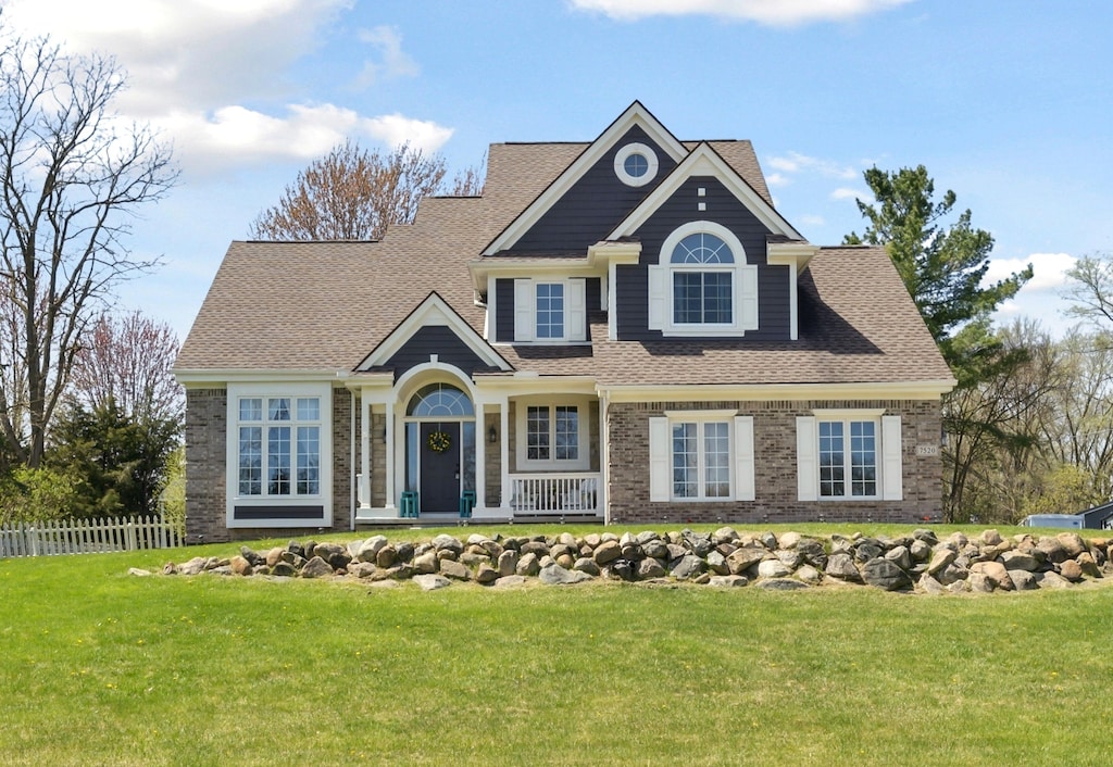 7520 Fairview Dr, Goodrich, MI 48438 - view of front of home with roof with shingles and brick siding