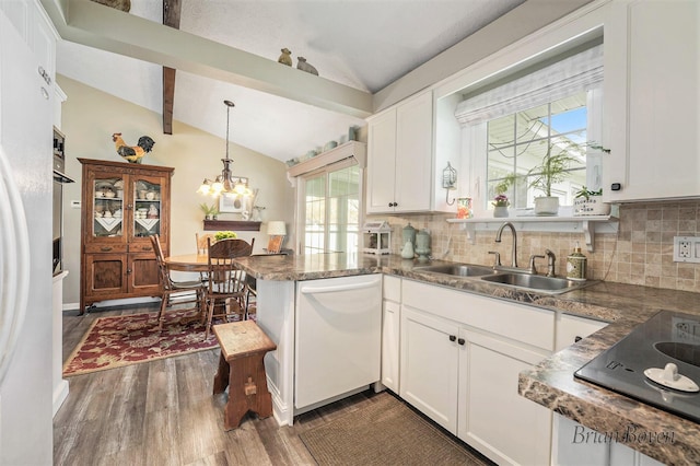 kitchen featuring backsplash, a sink, vaulted ceiling with beams, white appliances, and white cabinetry