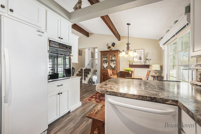 kitchen featuring dark wood-style flooring, dark countertops, black oven, freestanding refrigerator, and dishwashing machine