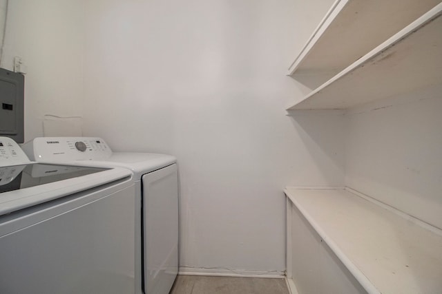 washroom featuring washing machine and clothes dryer and electric panel