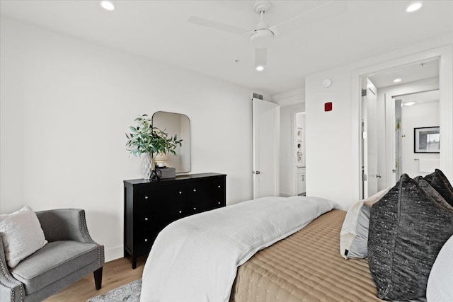 bedroom with recessed lighting, ceiling fan, baseboards, and light wood-type flooring