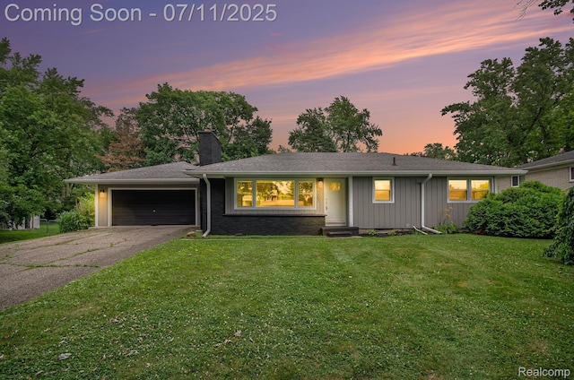 1082 Genella St, Waterford, MI 48328 - view of front of house featuring asphalt driveway, a garage, a chimney, a front yard, and board and batten siding