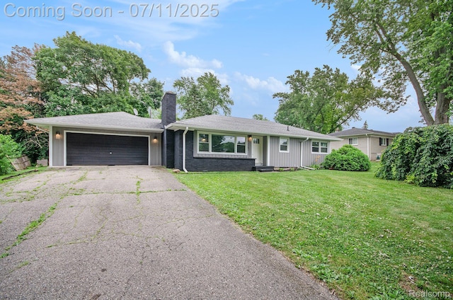 1082 Genella St, Waterford, MI 48328 - single story home featuring a chimney, asphalt driveway, a garage, and a front lawn