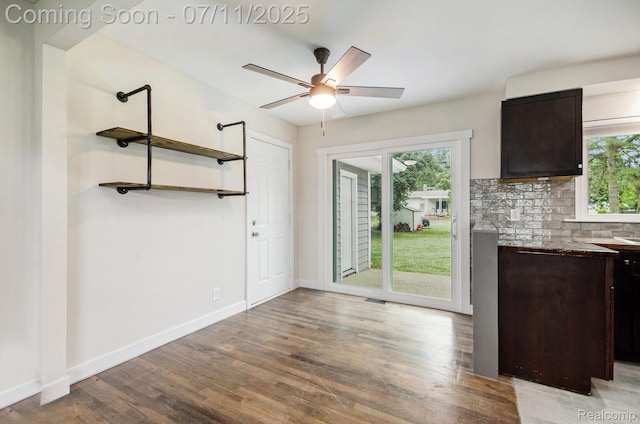 1082 Genella St, Waterford, MI 48328 - unfurnished dining area featuring healthy amount of natural light, wood finished floors, and a ceiling fan