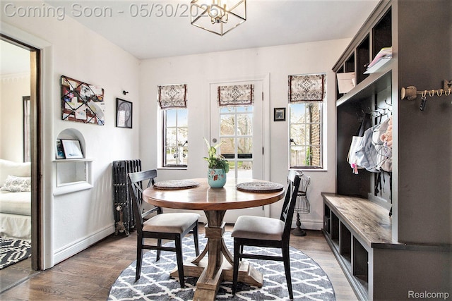 1301 Bishop Rd, Grosse Pointe Park, MI 48230 - dining space with light wood-style floors, a chandelier, and baseboards