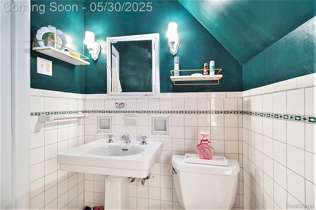 1301 Bishop Rd, Grosse Pointe Park, MI 48230 - bathroom with lofted ceiling, toilet, tile walls, and a wainscoted wall
