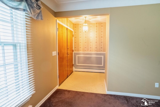 3336 Springdale St, Lambertville, MI 48144 - hallway with wallpapered walls, a baseboard heating unit, carpet, and a wainscoted wall
