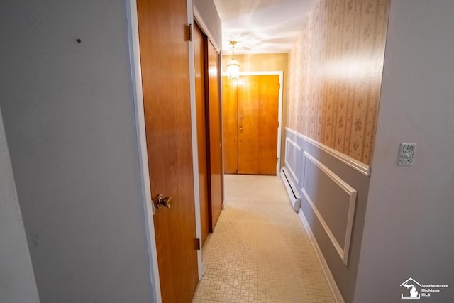 3336 Springdale St, Lambertville, MI 48144 - hallway featuring wainscoting, a baseboard heating unit, and wallpapered walls