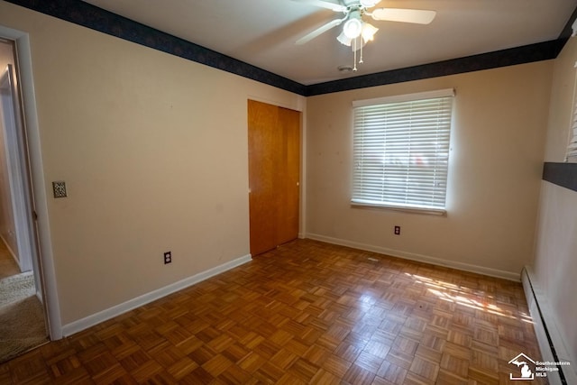 3336 Springdale St, Lambertville, MI 48144 - unfurnished room featuring baseboards, ceiling fan, and a baseboard radiator