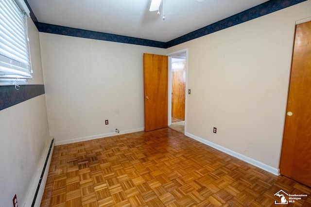 3336 Springdale St, Lambertville, MI 48144 - spare room featuring baseboards, ceiling fan, and a baseboard heating unit