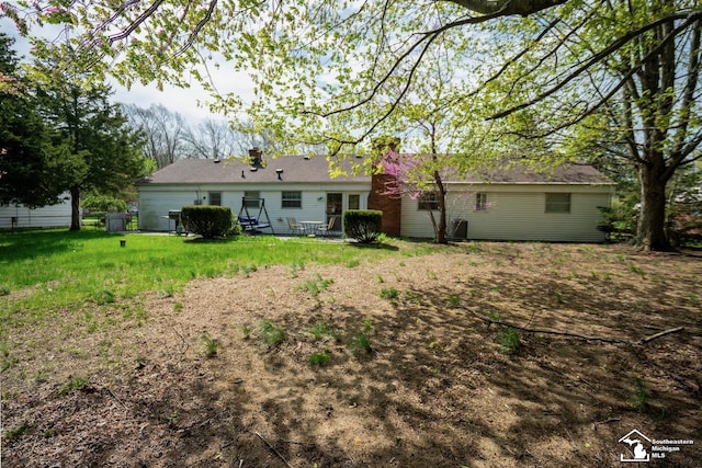 3336 Springdale St, Lambertville, MI 48144 - back of property with a chimney