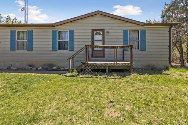 view of front facade with a front lawn and a deck