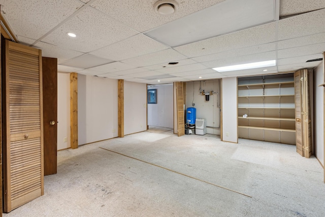 finished below grade area featuring recessed lighting, carpet flooring, and a drop ceiling