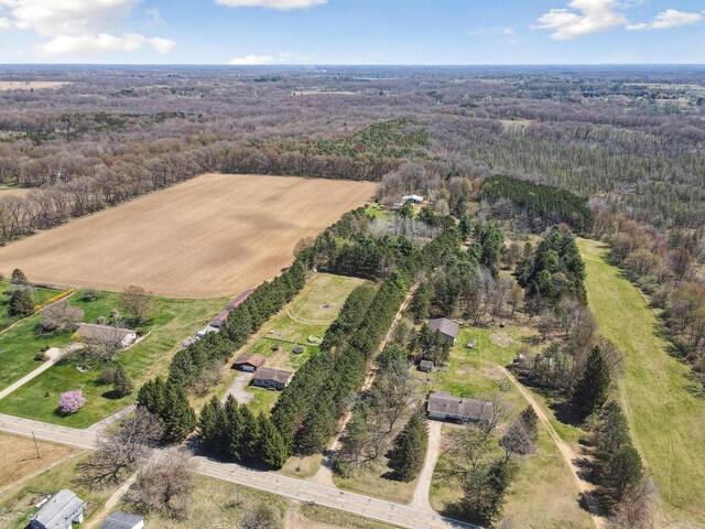 birds eye view of property featuring a rural view and a forest view