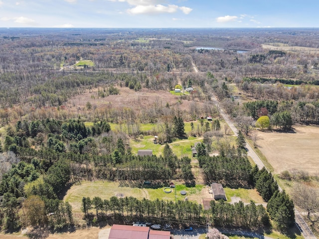 bird's eye view featuring a wooded view