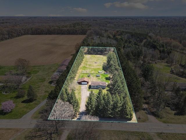 drone / aerial view with a rural view and a wooded view