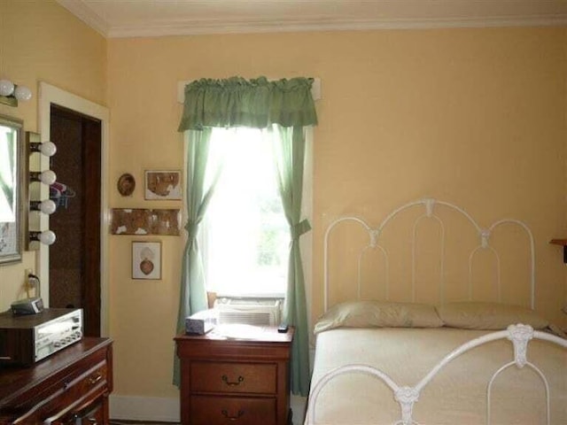bedroom with multiple windows, ornamental molding, and cooling unit