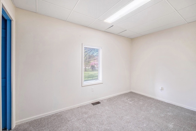 6093 Porter Rd, Grand Blanc, MI 48439 - spare room featuring visible vents, carpet, a paneled ceiling, and baseboards