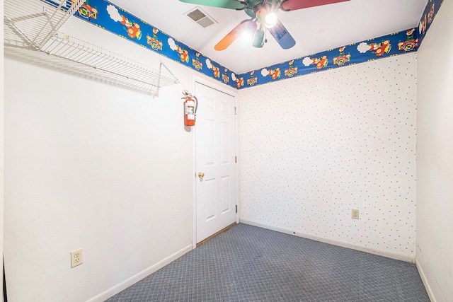 6093 Porter Rd, Grand Blanc, MI 48439 - spare room featuring visible vents, a ceiling fan, baseboards, wallpapered walls, and carpet flooring