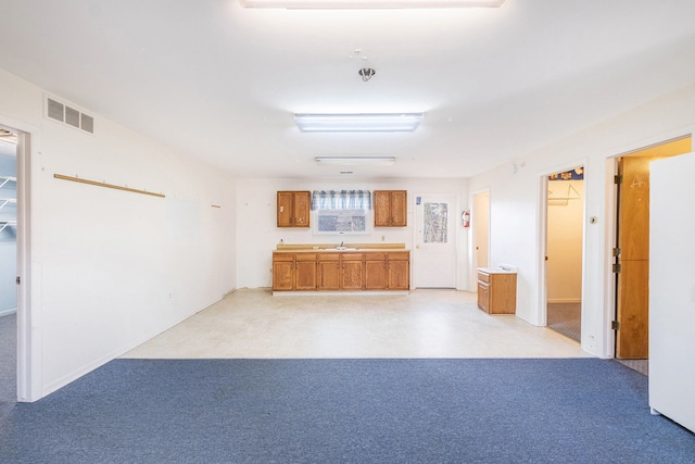 6093 Porter Rd, Grand Blanc, MI 48439 - interior space featuring carpet flooring, visible vents, and a sink