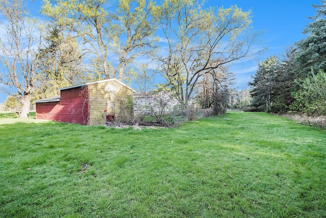 6093 Porter Rd, Grand Blanc, MI 48439 - view of yard with an outbuilding