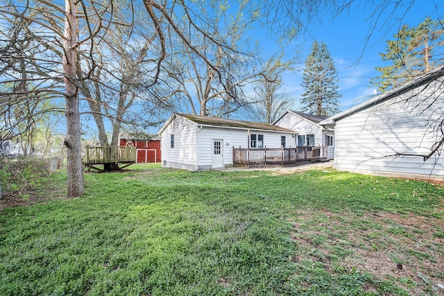 6093 Porter Rd, Grand Blanc, MI 48439 - rear view of house featuring a lawn and a deck