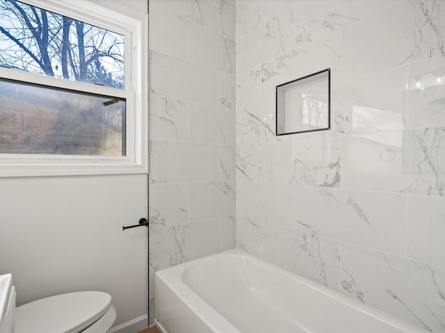 full bathroom featuring bathing tub / shower combination and toilet